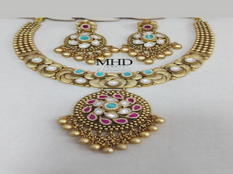 Traditional necklace and matching earrings with colourful stone detailing