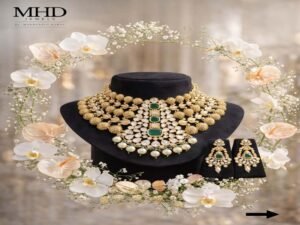 Elegant gold-tone necklace and matching earrings with green stones